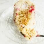 Mug cake with raspberries and coconut on a plate